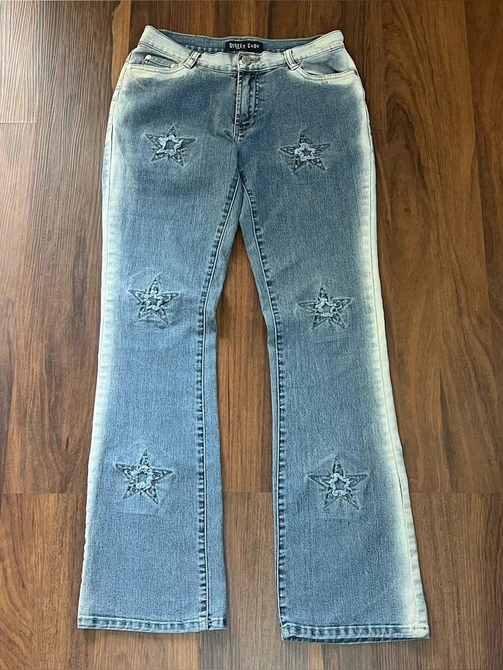 Vintage Y2K Street Code jeans with distressed star patch details